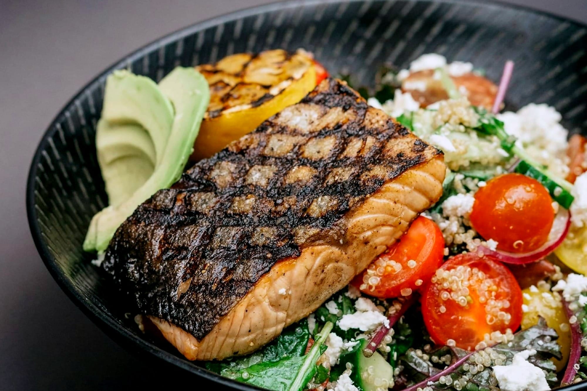 grilled salmon over a nutritious salad