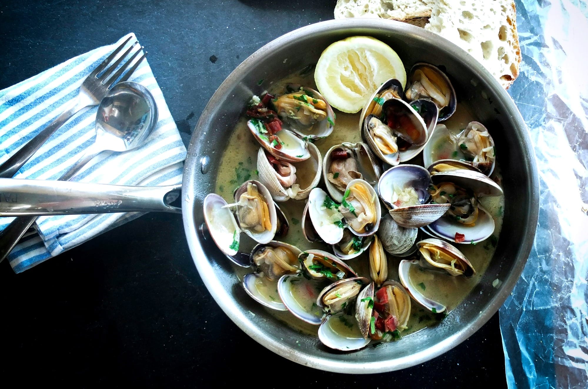 Pan roasted clams in steel pan