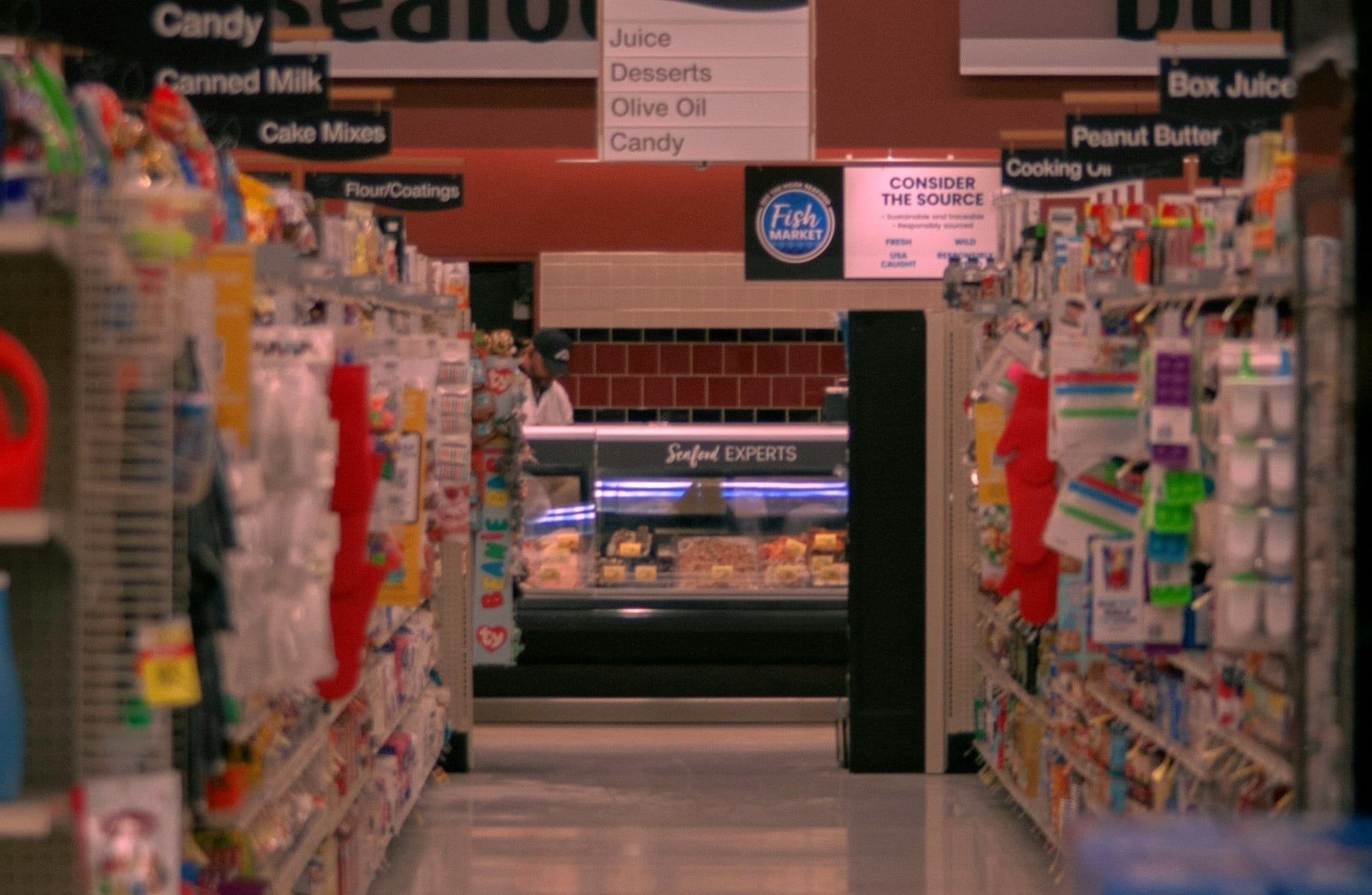 Supermarket isle leading to the meat and seafood section